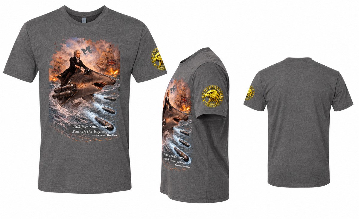 Collage showing front, left-side, and back views of a heather heavy metal 6 Sons Supply graphic T-shirt featuring Alexander Hamilton riding a hammerhead shark equipped with torpedo launchers amid British warships, with the eagle sleeve logo visible in the side view.